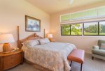 Unwind after a long day in your beautiful master bedroom with golf and ocean views
